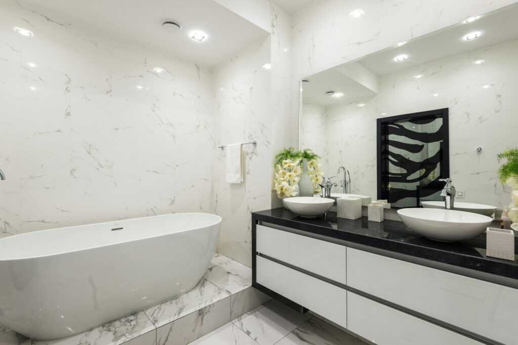 Bathroom Sanitization Elegant bathroom featuring a marble finish with modern fixtures and decor.